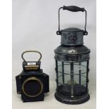 An Oldfield Dependence lamp 23 cm high, and a Griffiths lamp, 42 cm high (2)