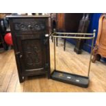 An Edwardian brass umbrella stand, 43 cm wide, a stool, and an oak bedside cupboard, 39 cm wide (2)