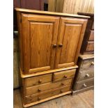 A pine chest, of four drawers, 84 cm wide, a pine bedside chest of three drawers, a pine two door