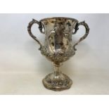 A large Victorian silver two-handle trophy cup, with rococo style embossed decoration, London