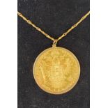 An Austrian gold 4 Ducats, 1915 re-strike, in an 18ct gold pendant mount, on a chain Report by RB
