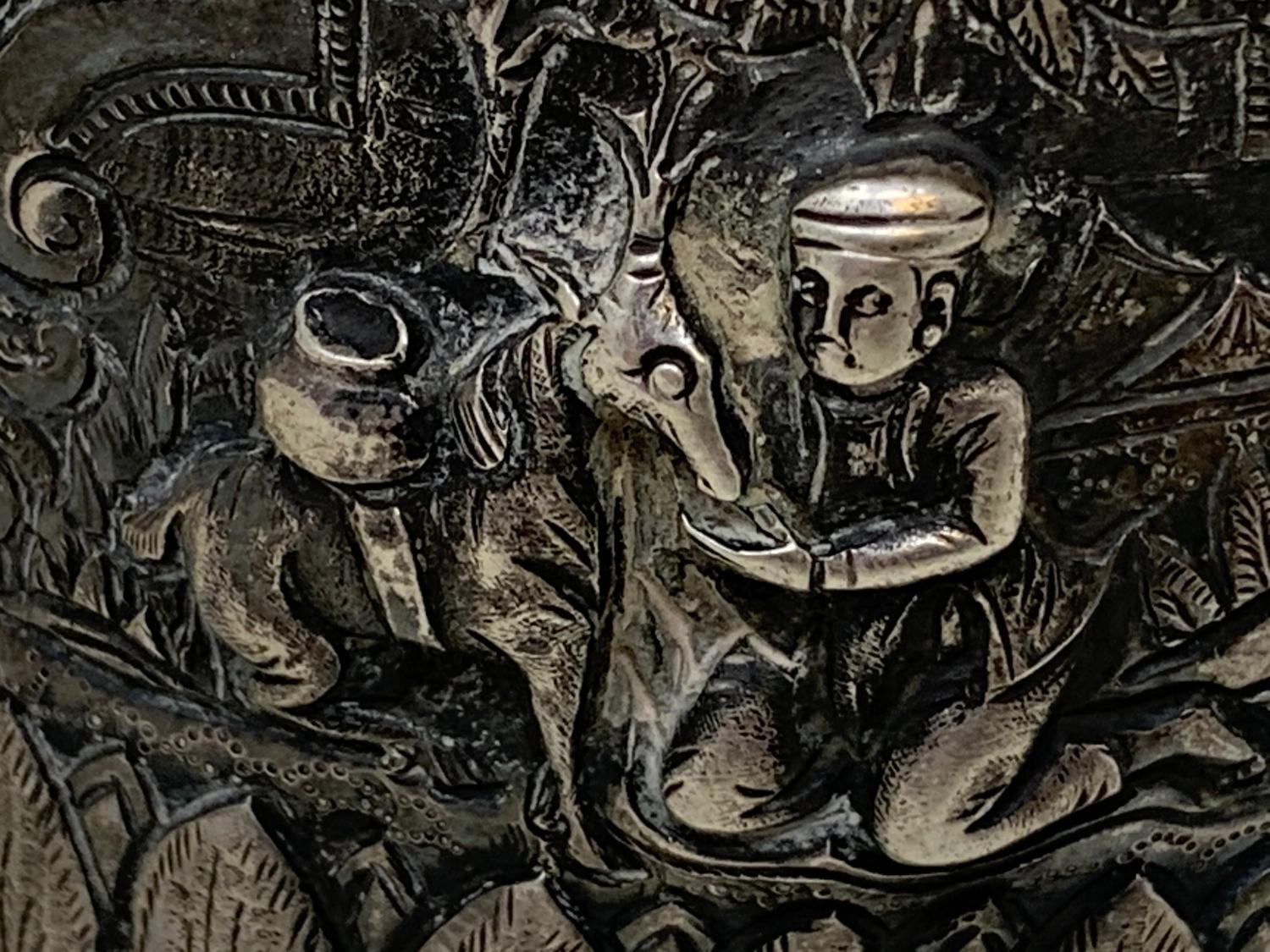 A Burmese silver coloured metal cylindrical box and cover, embossed figures, the base engraved a - Image 6 of 8