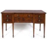 A George III style inlaid mahogany sideboard, having an arrangement of drawers, on tapering square