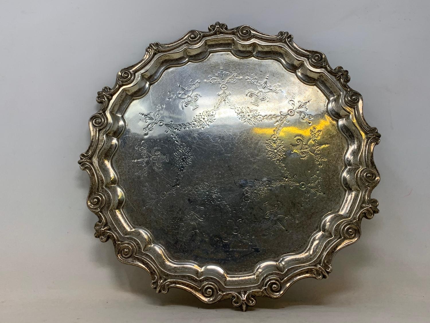 An 18th century style silver salver, engraved foliage and swags, marks rubbed, 18.8 ozt, 28.5 cm