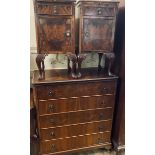 A pair of early 20th century burr walnut bedside chests, each with a brushing slide above a drawer