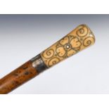 A late 17th/early 18th century walking stick, with a carved ivory pique decorated handle and a