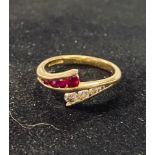 An 18ct gold, diamond and ruby crossover ring, approx. ring size K 3.1 g all in generally good