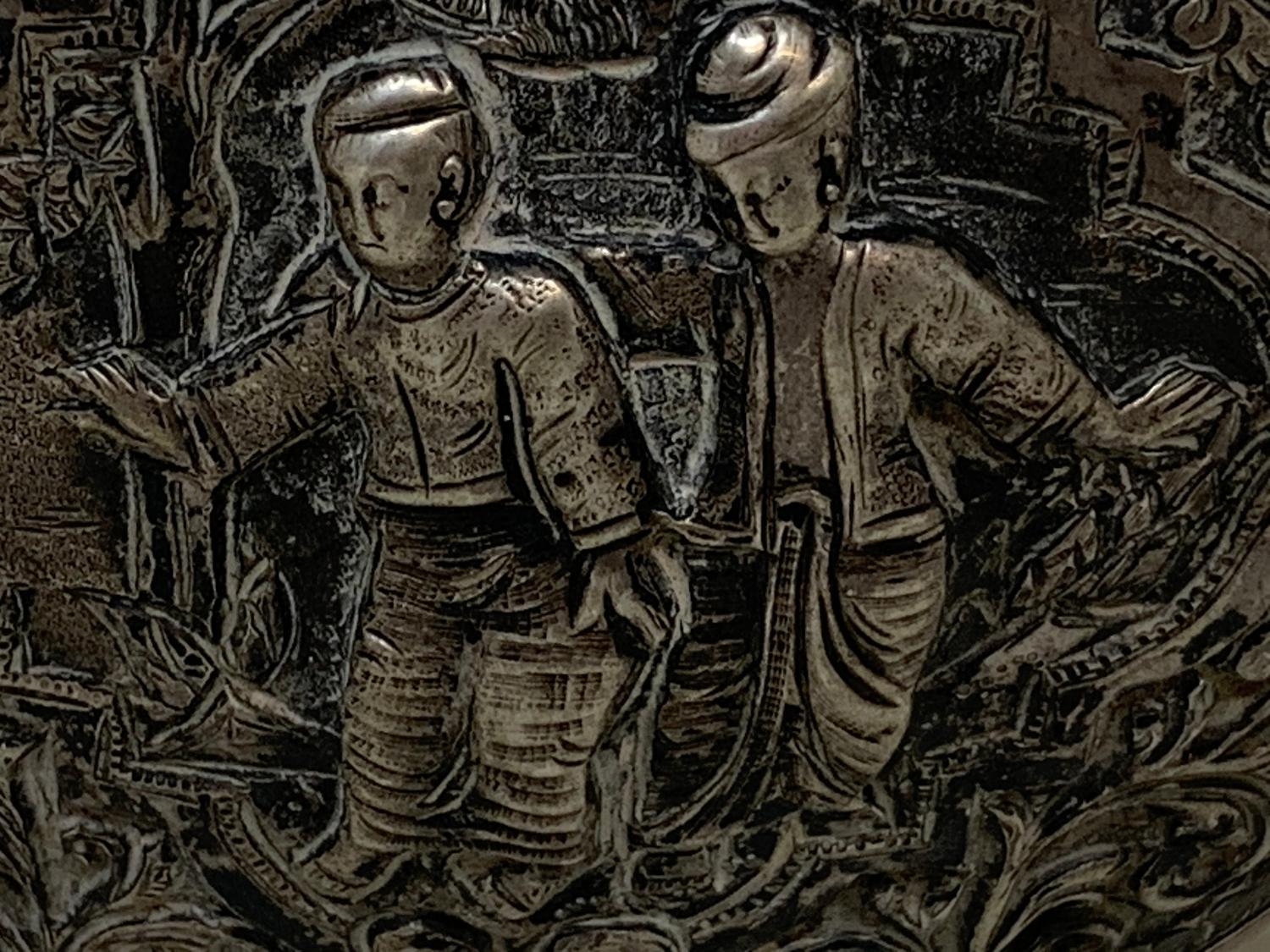 A Burmese silver coloured metal cylindrical box and cover, embossed figures, the base engraved a - Image 3 of 8