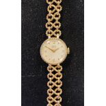 A lady's 9ct gold Tudor Royal wristwatch, on a 9ct gold link bracelet, 22.4 g (all in) Clasp