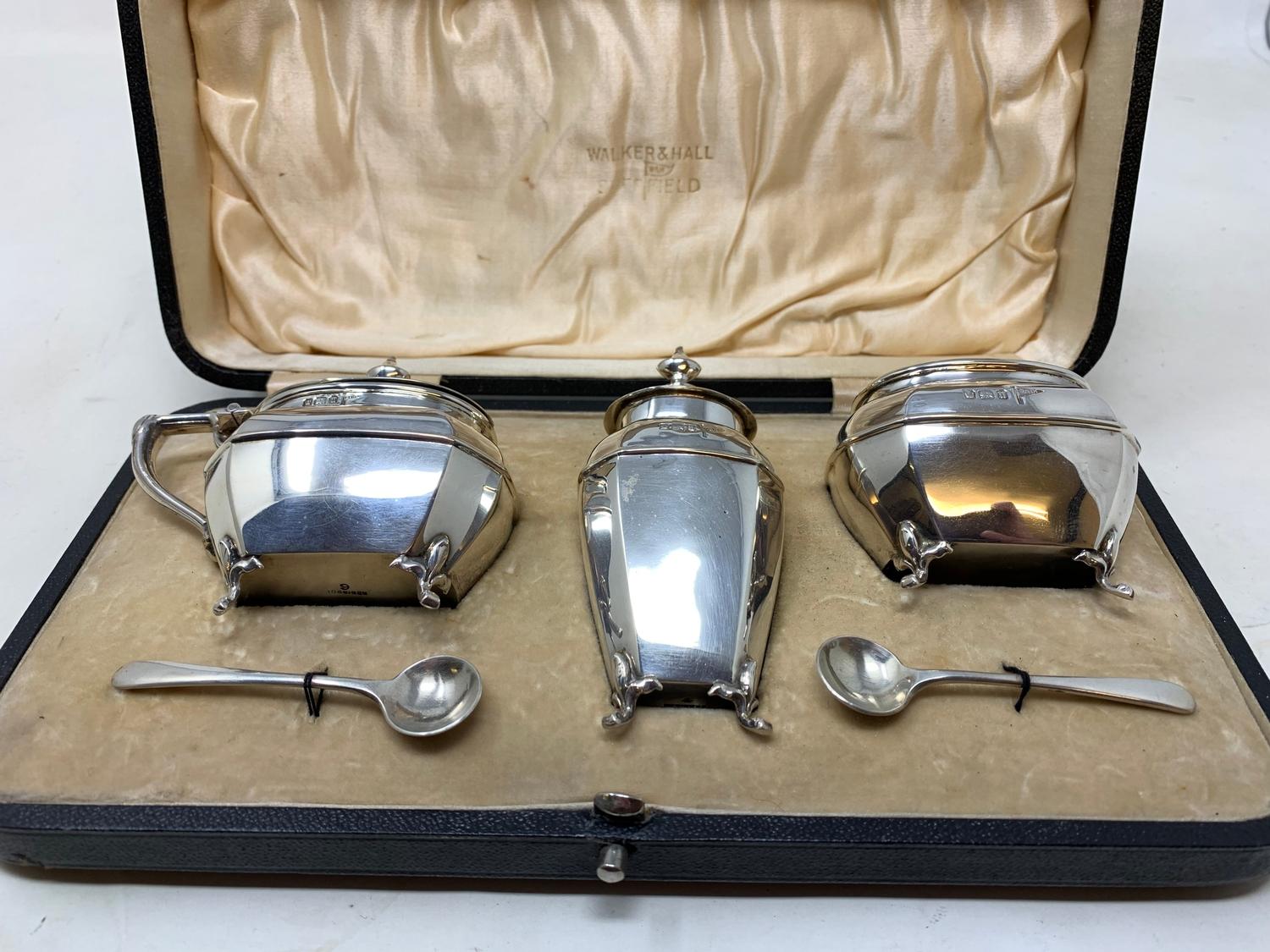 A silver three piece condiment set, Walker & Hall, Sheffield, 1912, boxed From a deceased estate,