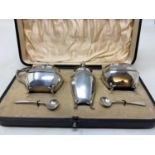 A silver three piece condiment set, Walker & Hall, Sheffield, 1912, boxed From a deceased estate,