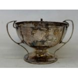 An Arts & Crafts style Silver three-handle trophy, Birmingham 1912, 5.6 ozt, 10.5 cm high Worn thin,