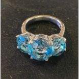 A silver and three stone blue topaz dress ring, approx. ring size N½ Report by RB Modern