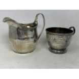 A commemorative silver cup, Birmingham 1936, and a silver milk jug, 6.8 ozt (2)