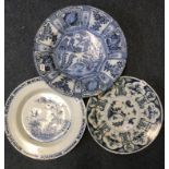 A Delft charger, decorated birds and figures, riveted, 41 cm diameter, and two others similar, 36.