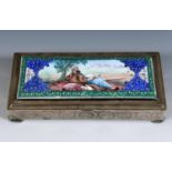 A Persian silver coloured metal and enamel table cigarette box, decorated a reclining figure