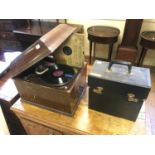 An HMV gramophone, in a mahogany case, assorted records case scratched