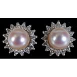 A pair of white gold, cultured pearl and diamond stud earrings