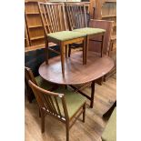 A Vanson mid-century teak extending dining table, inset three extra leaves, 244 cm wide and a