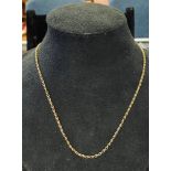 A yellow coloured metal rope twist chain Report by RB not tested, carat not known 9.2 g