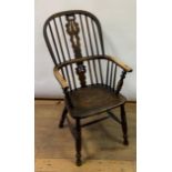 A late 19th/early 20th century Windsor style kitchen armchair