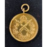 A yellow coloured metal rifle shooting medallion Report by RB Carat not stamped 14.6 g
