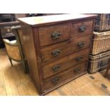 A late Victorian walnut chest, of five drawers, 98 cm wide, an Edwardian inlaid mahogany armchair,