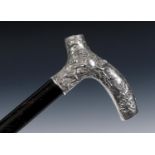 A fine 19th century French walking cane, the cast Tau shaped silver coloured metal handle with