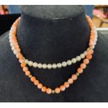 A coral bead necklace, with a 14ct gold clasp, and a cultured pearl necklace, with a 14ct gold clasp