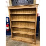 A pair of open pine bookcases, on plinth bases, 126 cm wide (2) generally good, from a deceased