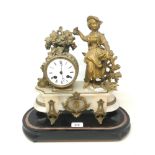 A late 19th century mantel clock, with Roman numerals, in a gilt spelter and alabaster figural case,