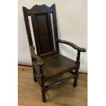 An 18th century oak Wainscot armchair, with a panel back