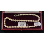 A string of graduated cultured pearls, with a 9ct white gold clasp, in a Mappin & Webb case Report