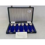 A set of six Egyptian silver coloured metal teaspoons, with camel and crescent finials, cased