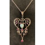 A silver, opal and ruby set necklace Report by RB Modern