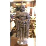 A cast iron fire companion, in the form of a Roman centurion, 63 cm high, with a poker
