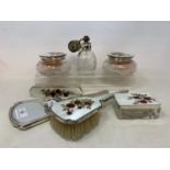 A silver and enamel seven piece dressing table set, decorated roses, Birmingham 1959 Report by RB