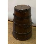 A coppered oak barrel, with iron handles, and an associated lid, 61 cm high
