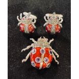 A silver and enamel ladybird type bug brooch, and similar cufflinks Report by RB bug approx. 3 cm