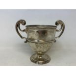 A silver two handle trophy cup, London 1906, 7.7 ozt, 12 cm high