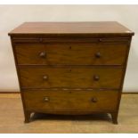 A 19th century mahogany chest, having a brushing slide above three graduated long drawers, on
