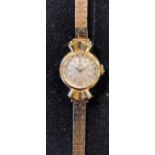 A lady's 9ct gold Omega wristwatch, on a 9ct gold strap, 21.2 g (all in)