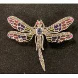 A silver dragonfly brooch/pendant