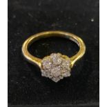 An 18ct gold and diamond flowerhead ring, approx. ring size O, 4.1 g (all in) Generally good