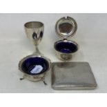 A silver cigarette case, two silver condiments, and a small silver trophy cup, 8.8 ozt
