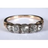 An 18ct gold and five stone diamond ring, approx. ring size O Centre stone approx. 4.5 mm diam