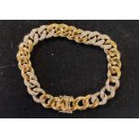 An 18ct gold and diamond curb link bracelet Report by RB Weight is: 36 g (all in) Modern