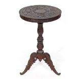 A tripod table, carved grapes and vines, 43.5 cm diameter