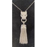 A modern silver coloured metal necklace, pendant in the form of a Jaguar holding a tassel Report