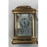 A modern brass carriage clock, inset with painted porcelain panels, 10 cm high Report by JS This